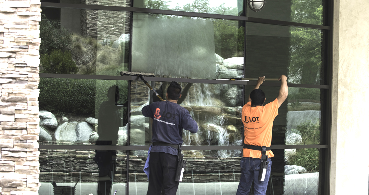Commercial window washing team at work